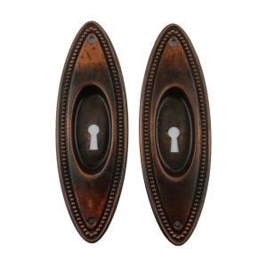 Oval Bead Pocket Door Pair Keyhole